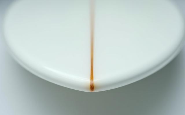 Rebuilt and perfectly shaped surfboard nose after extensive repair, with a smooth, continuous curve and strong finish.